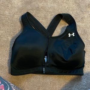 Under armour sports bra, built in cup, cross in back, heat gear ,med zip front
